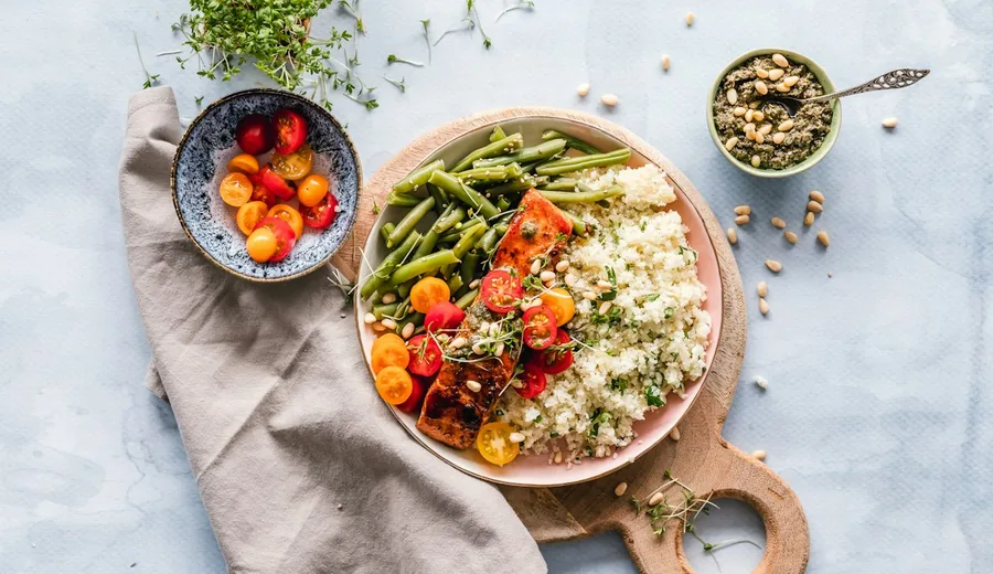Measured and balanced meal prep container with roasted vegetables, legumes, and lean protein