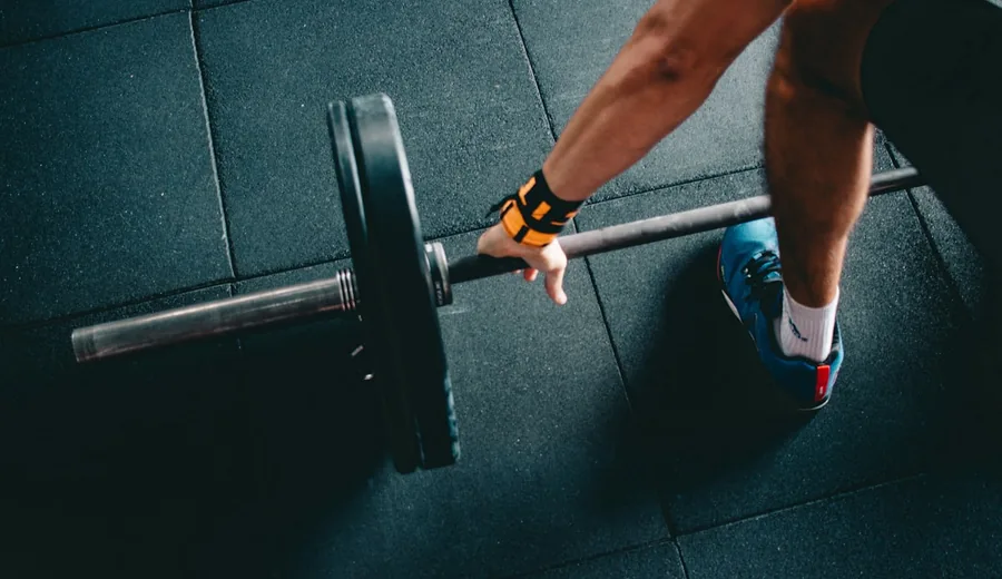 Strength training workout equipment illustrating muscle mass preservation and metabolic rate support