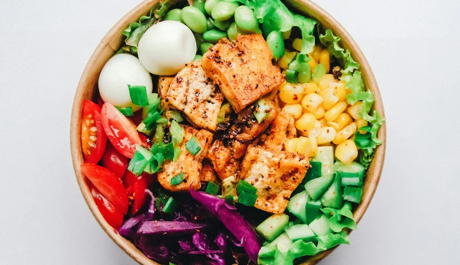 Vibrant organic tofu and vegetable stir-fry over steaming brown rice