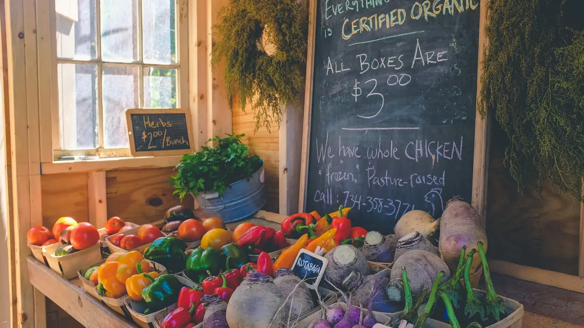 Fresh whole fruits, vegetables, and unprocessed grains contrasting with packaged snack foods